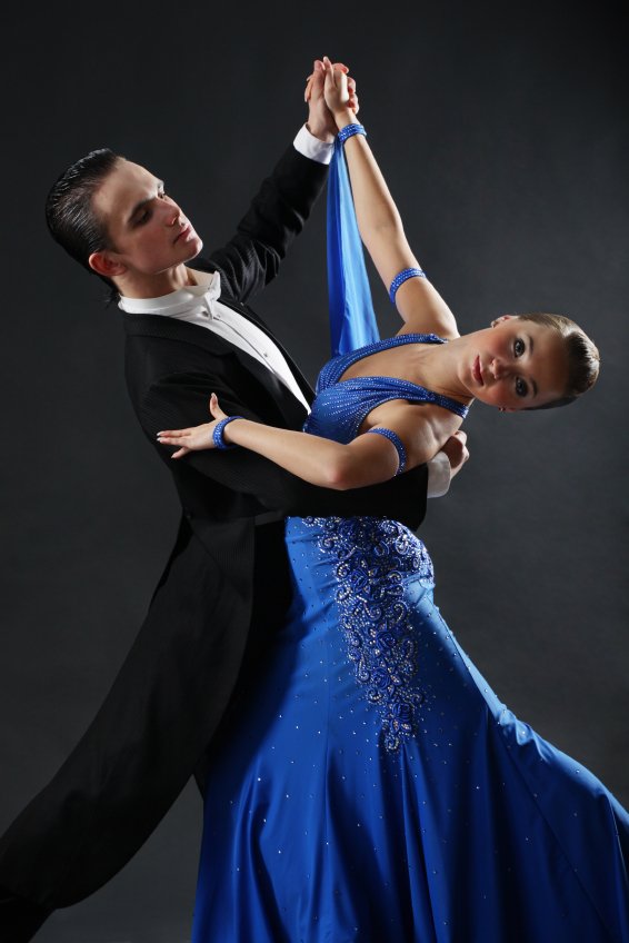 elegant couple in a ballroom dancing class