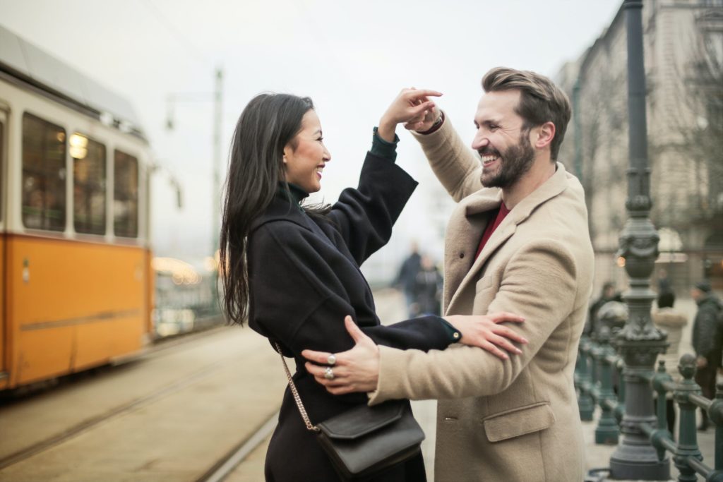 happy young couple learning to dance