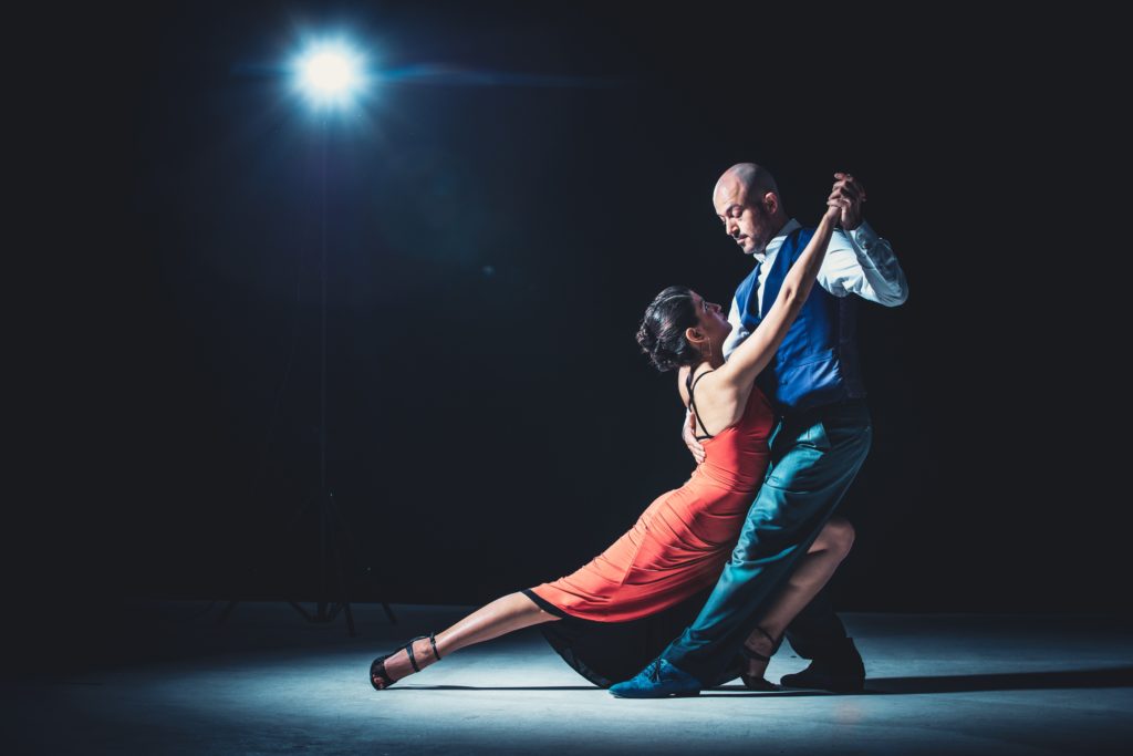 Couple completing ballroom dance routine